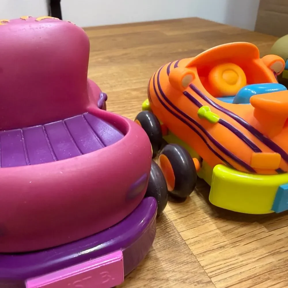 B. Toys Pull Back Trucks Taxi Cab Convertible Lot of 4 Flower Car Play Imaginati